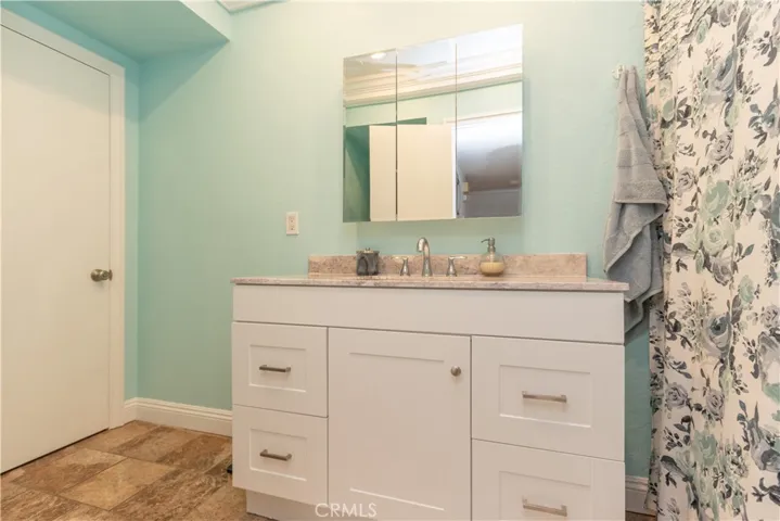 Jack and Jill bath opens to hall and primary suite.