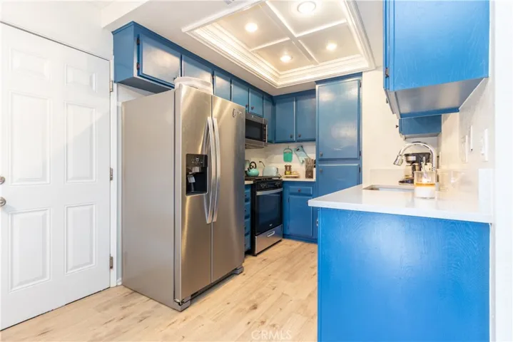 Charming kitchen near garage entry.