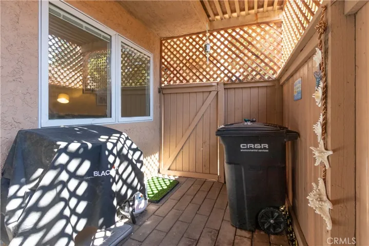 Grill and trash storage.