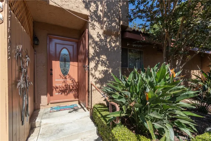 Property with fully enclosed front patio.