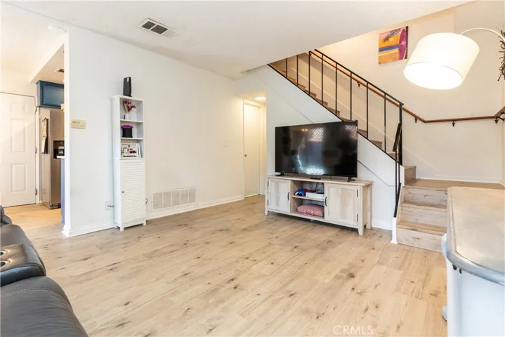 Main level with living room, dining room, kitchen and powder room.