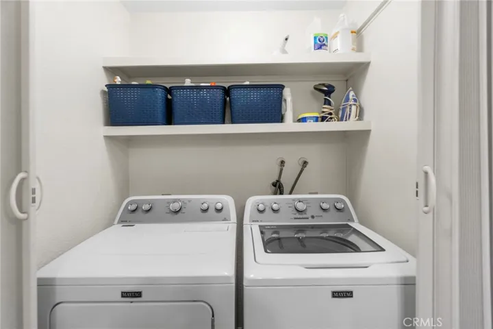 Laundry closet located in bathroom