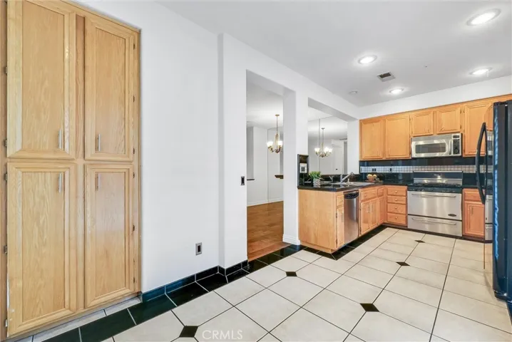 Spacious kitchen with stylish tiled floor