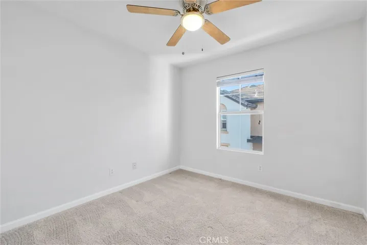 Secondary bedroom #2 with brand-new ceiling fan