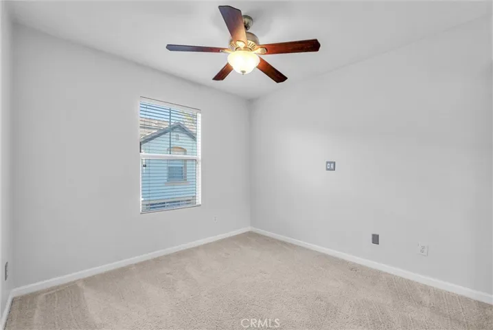 Secondary bedroom #1 with ceiling fan