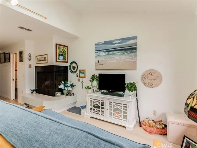 View of living room and gas fireplace.