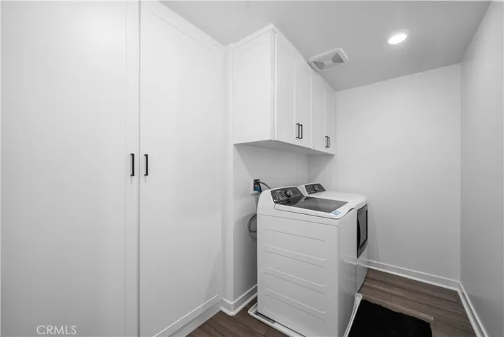 Upstairs laundry room with built-ins