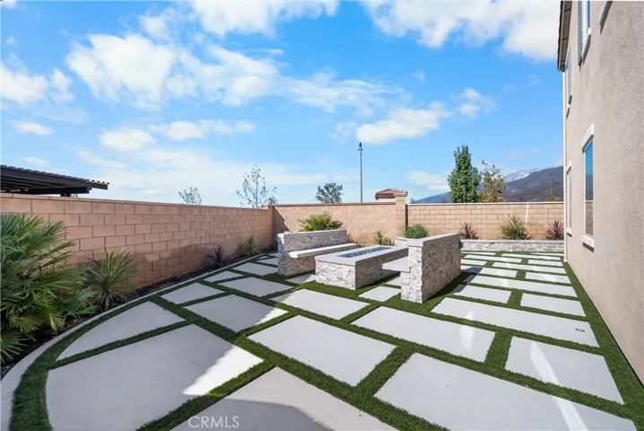 Custom water-wise landscaping w/ firetable & seating