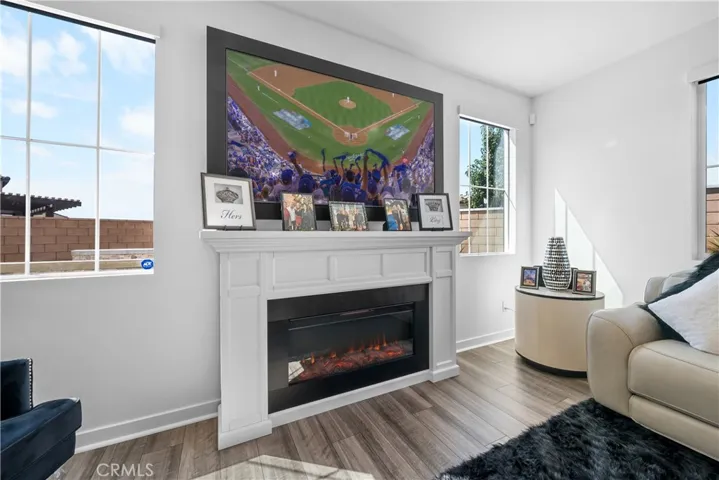 Family room with fireplace & framed in TV