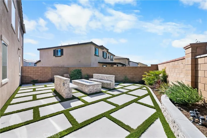 Custom water-wise landscaping w/ firetable & seating