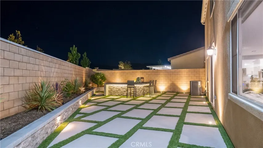 Landscaped with hardwired lighting