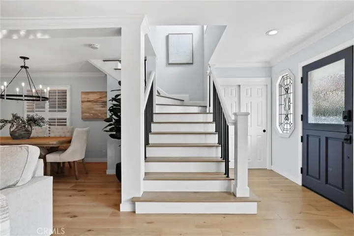 entry living, dining with stairs to second floor