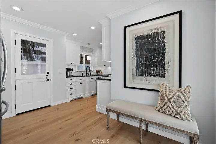 foyer off of kitchen and back entry doors from garage and side yars