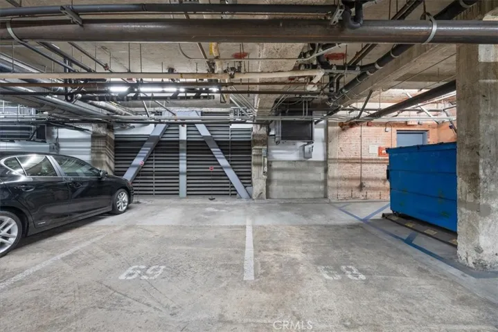 Side by Side Assigned parking spaces with EV outlet on wall