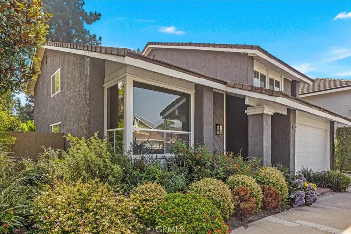 Situated on a cul-de-sac in the Woodside tract of Northwood in Irvine, 30 Alondra is a MUST-SEE.