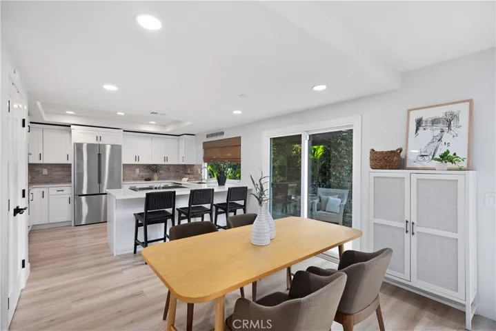Casual dining area has sliding door that opens to the nicely landscaped backyard.
