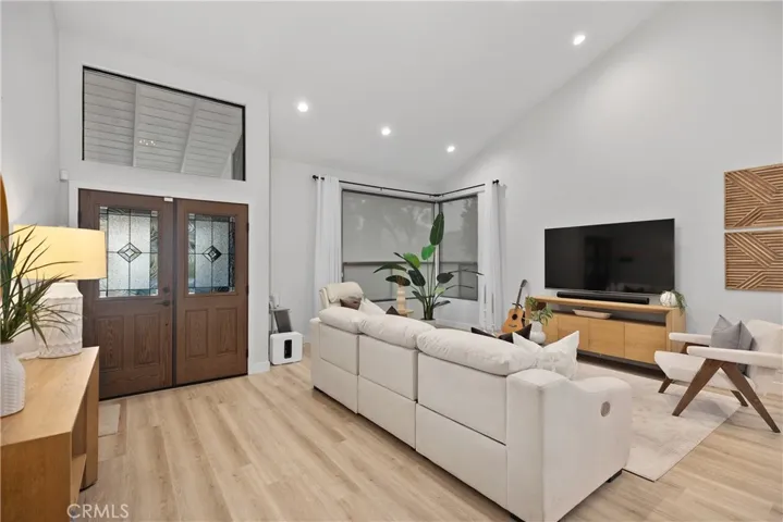 Entry and formal living room feature high ceilings which adds to the grandeur of this home.