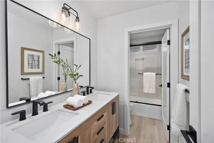 Upstairs hallway bathroom that features double sinks and designer finishes.