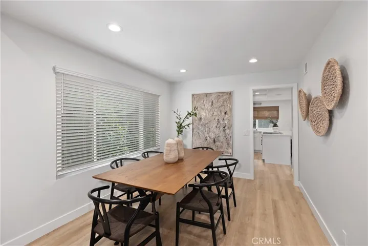 Formal living room opens to formal dining room.