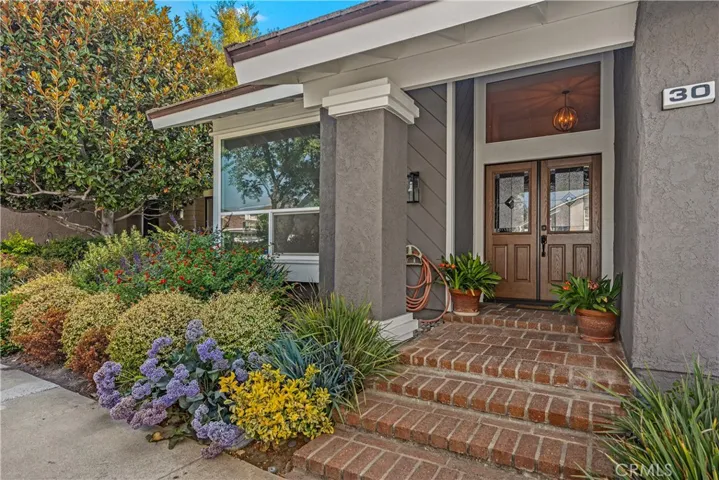 A double entry door welcomes you to this exquisite 5 bedroom home.