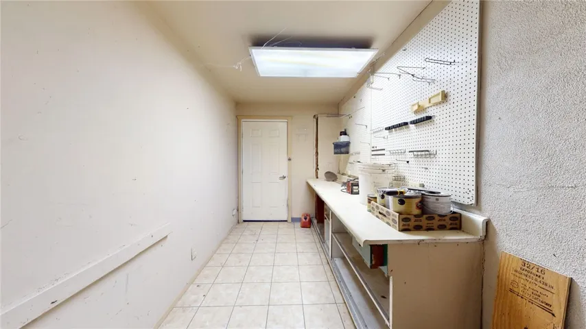Spare room that can be used as a utility closet, man cave, she shed or you decide!