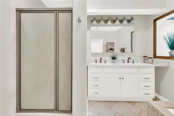 Primary bathroom with jacuzzi and walk in shower