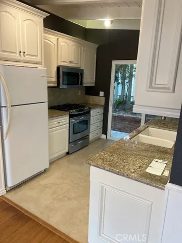 Refrigerator, gas range, dishwasher and mircowave all included