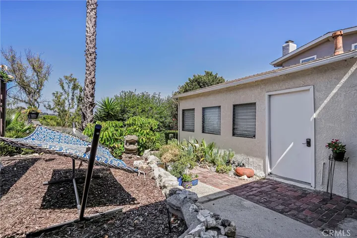 Existing 2-car garage with views provides opportunity for office, workshop and ample storage.