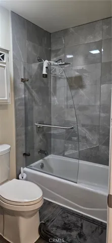 Bath 2 updated with tile wainscoting, glass