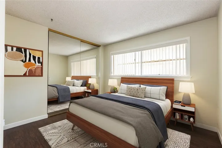 virtually staged third bedroom across from the shared bathroom