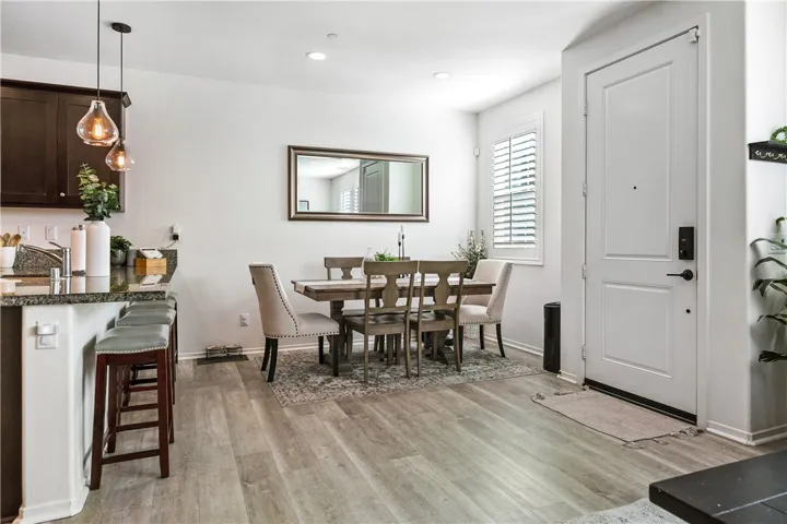 Convenient breakfast counter with pendant lighting is both functional & tasteful.