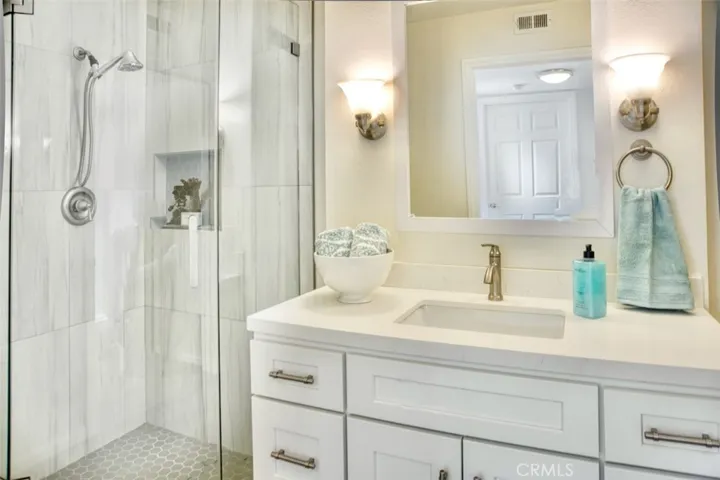 Upstairs bath has full shower