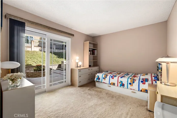 downstairs bedroom with up-graded patio slider!