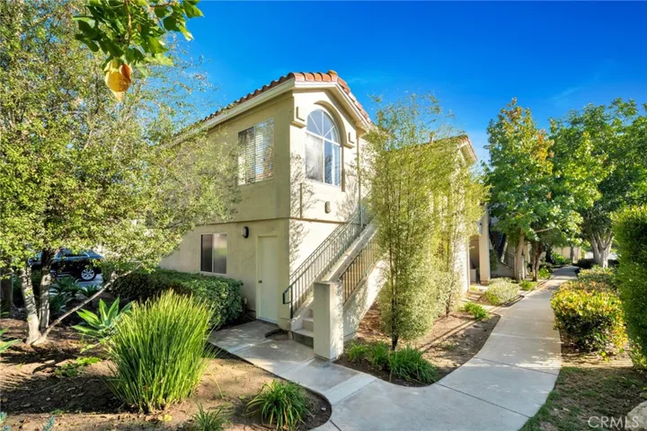 corner unit; lush landscaping