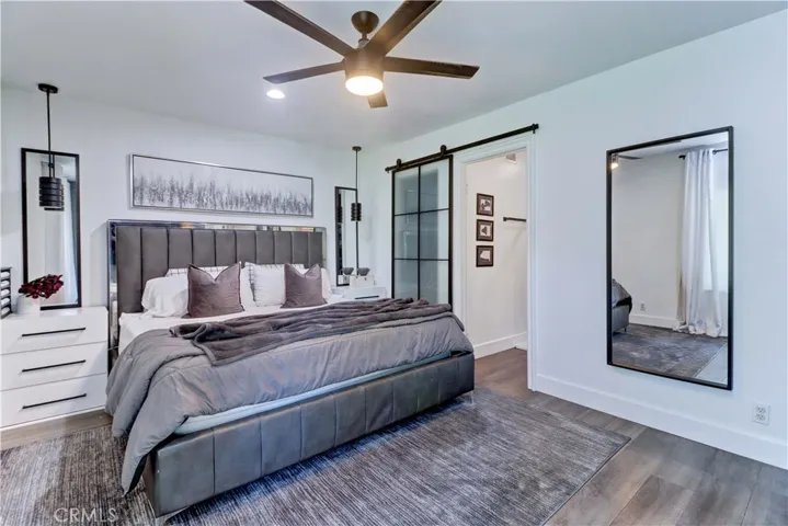 Primary bedroom with ceiling fan.