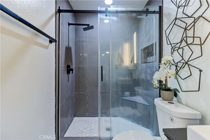 Updated primary bathroom with walkin shower.