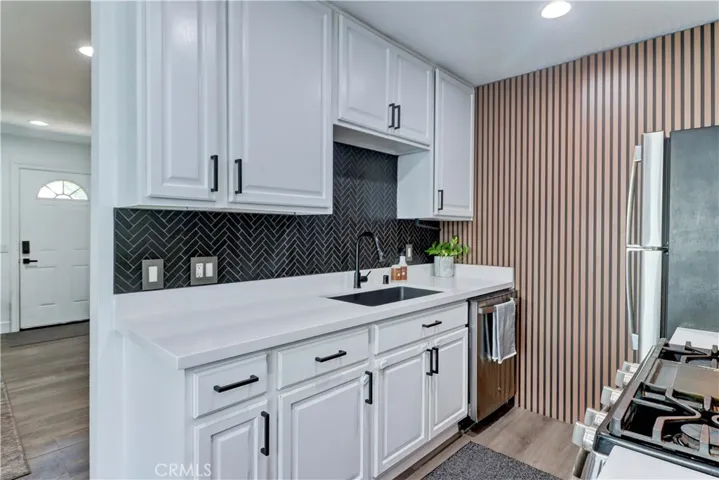 Remodeled kitchen with quartz counter tops.