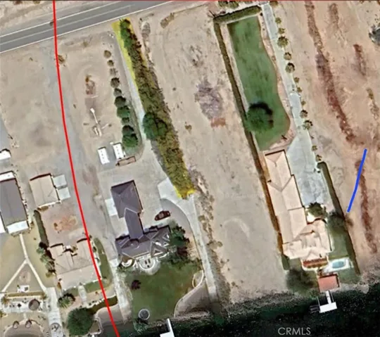 Tree section on left side of property is the County easement.