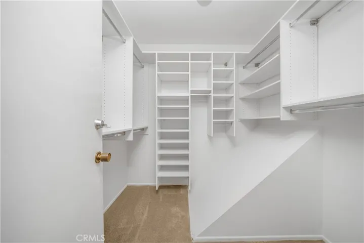 Primary Bedroom Walk-in Closet with Custom Shelving