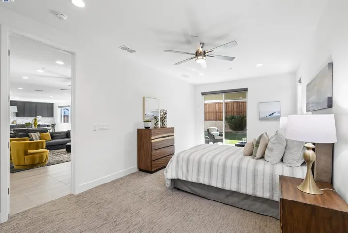 Downstairs next-gen suite with attached bath and walk-in closet