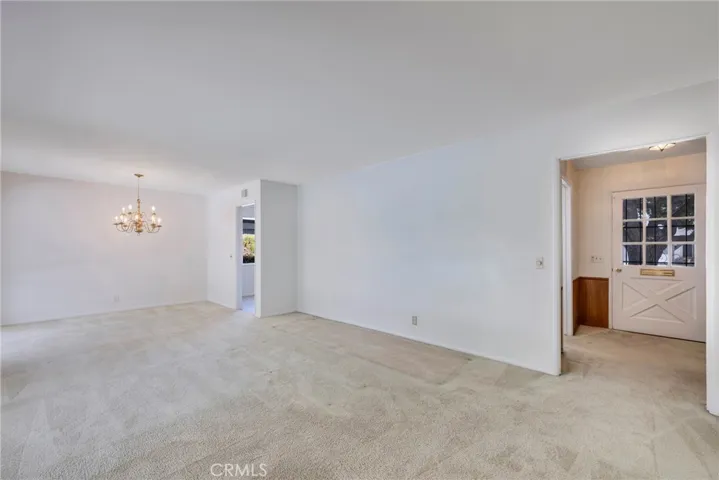 Dining Room and Living Room and view of front door