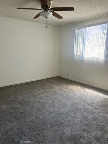 Ceiling fan and lots of natural light in the bedroom