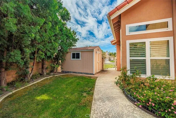 The opposite side of the yard has a large shed for storage