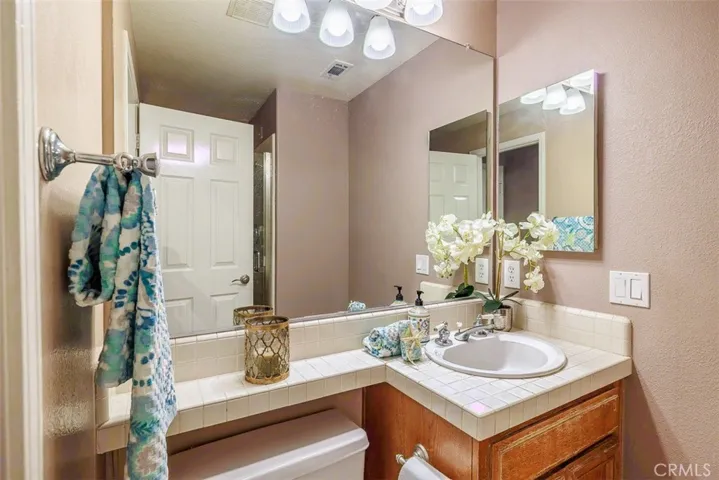 This is the first floor 3/4 bath room (shower is behind the door). Currently closed off from the first floor bedroom. Doorway could be very easily re-added at the right of this picture. See the floor plan at the end of these pictures