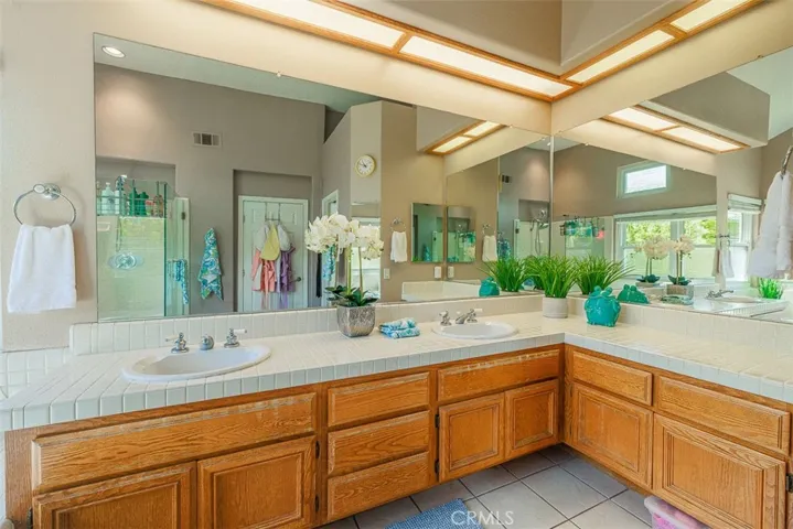 Plenty of counter space, mirrors, and storage in the primary bath