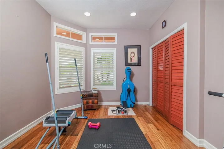 Here is the first floor bedroom with added recessed lighting. Currently used as an exercise room.