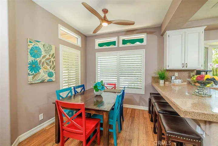 The nicely-sized dining area and breakfast counter are adjacent to the kitchen