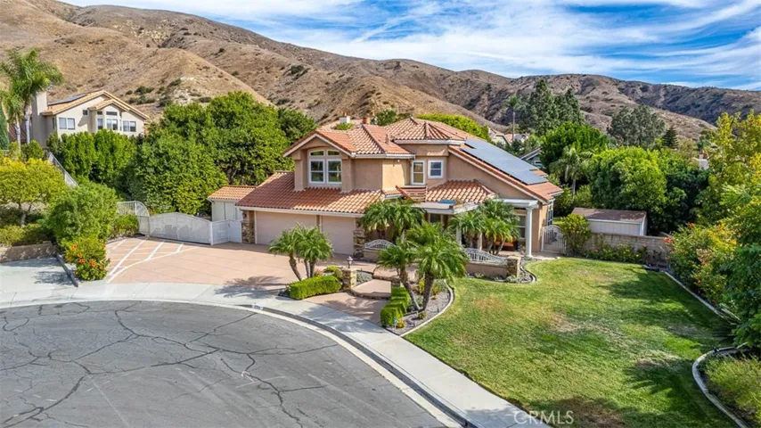 Set back from the street and tucked away in the cul-de-sac on an over 14,000 square foot lot