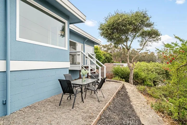 Front patio area with deck and staircase.from livingroom