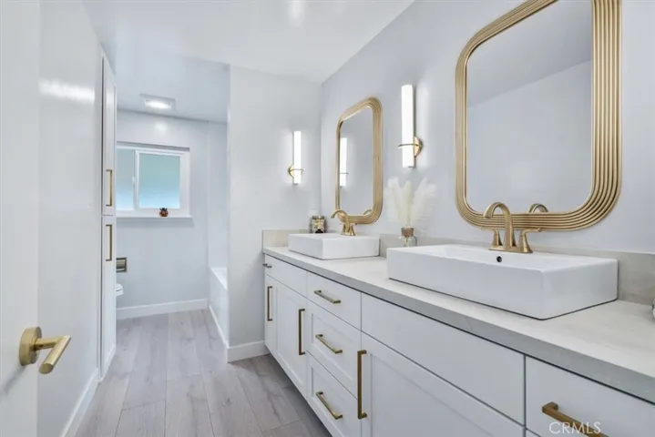 Hall bath with huge quartz slab and soaking tub/rain shower.